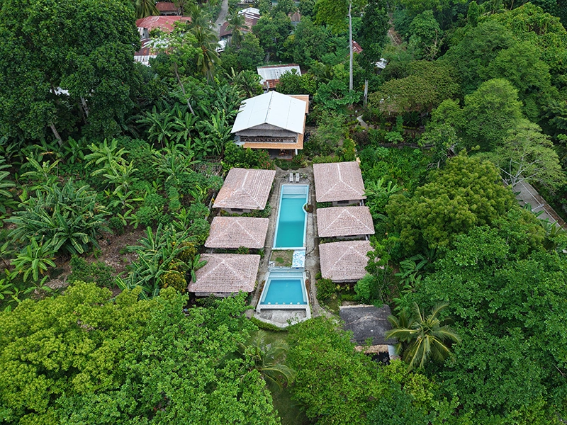Blue Season Camiguin resort exterior view with beachfront and pool